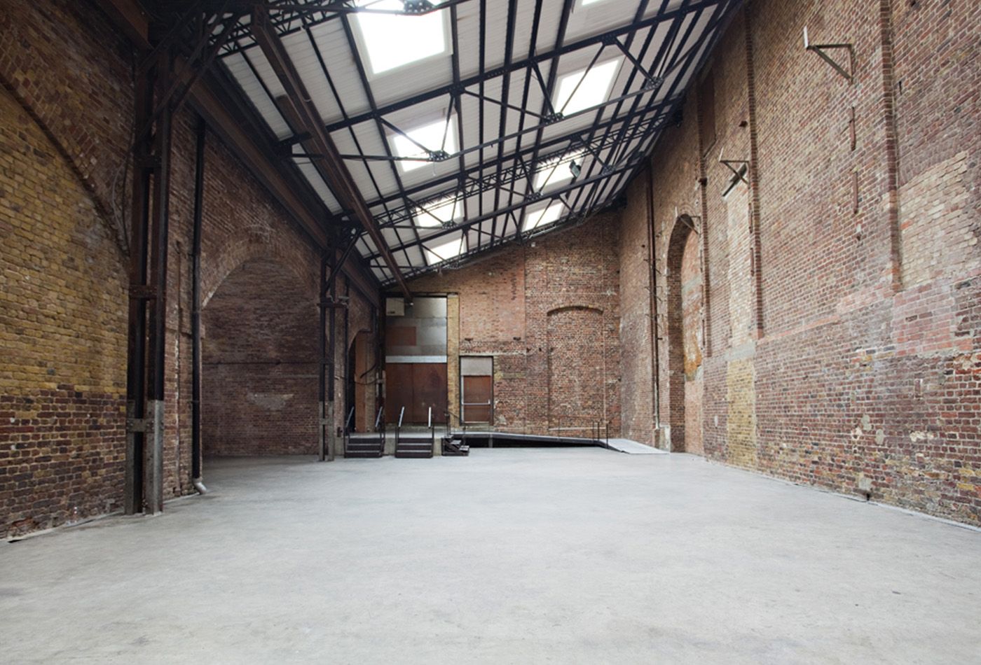 Revamped warehouse with lots of open space and vaulted ceiling 