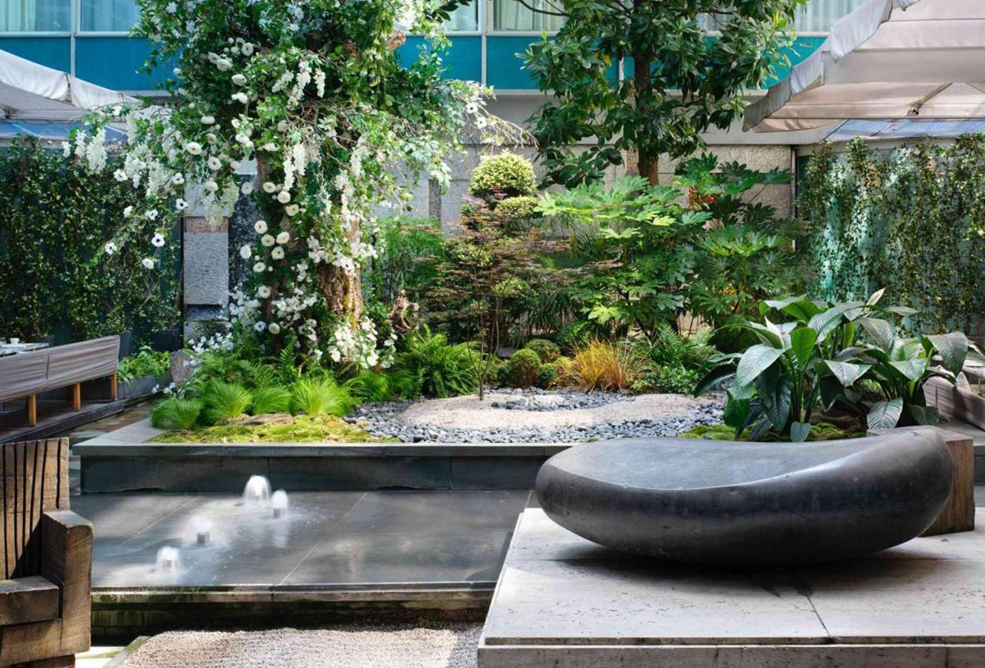 Outdoor marble water feature and greenery