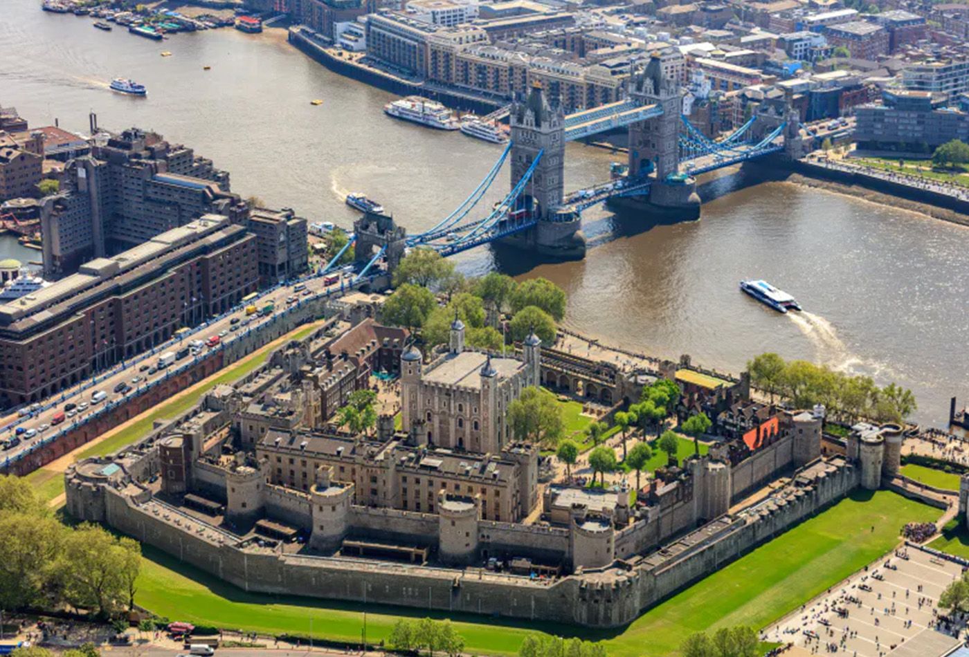 Birdseye view of tower of london with london bridge in the background