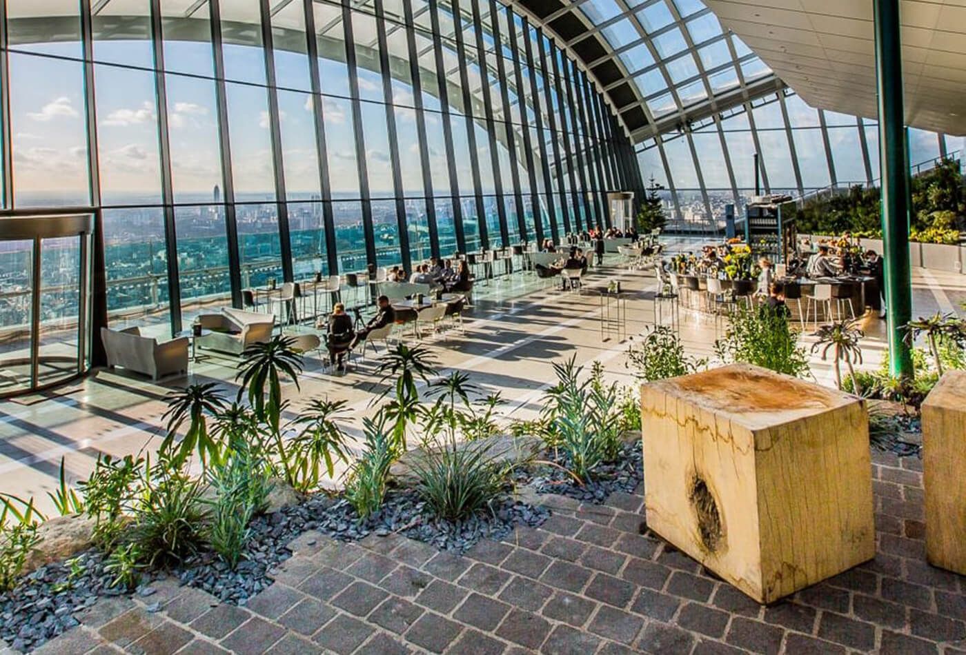  Lush greenery, seating and views of the city’s iconic skyline in the daytime.