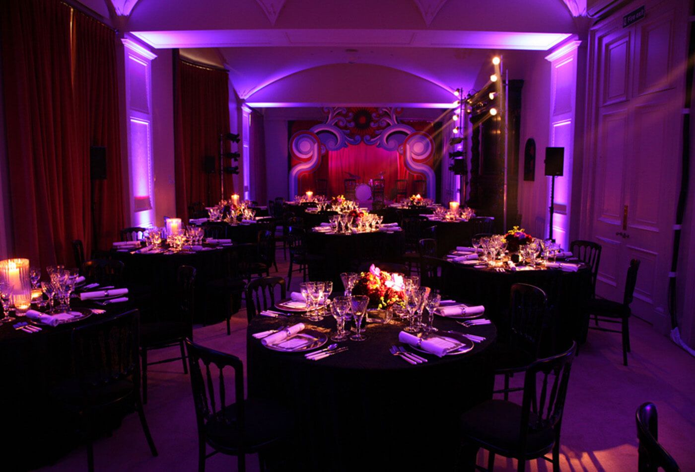 Dark purple and black dining set up with red stage