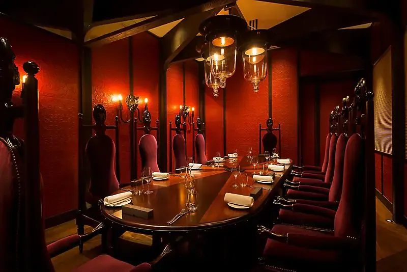 Dark red and mahogany dining room.webp